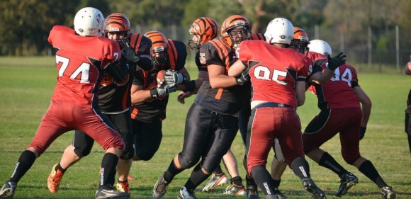 Miners fullback Sammy Karag rushes for a Touchdown