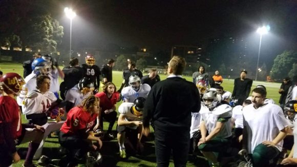 Head Coach Rob Smith of the Melbourne Uni Lions addresses the Under 19's team after training